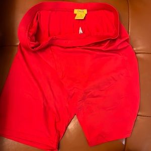 Red polyester and spandex biker shorts